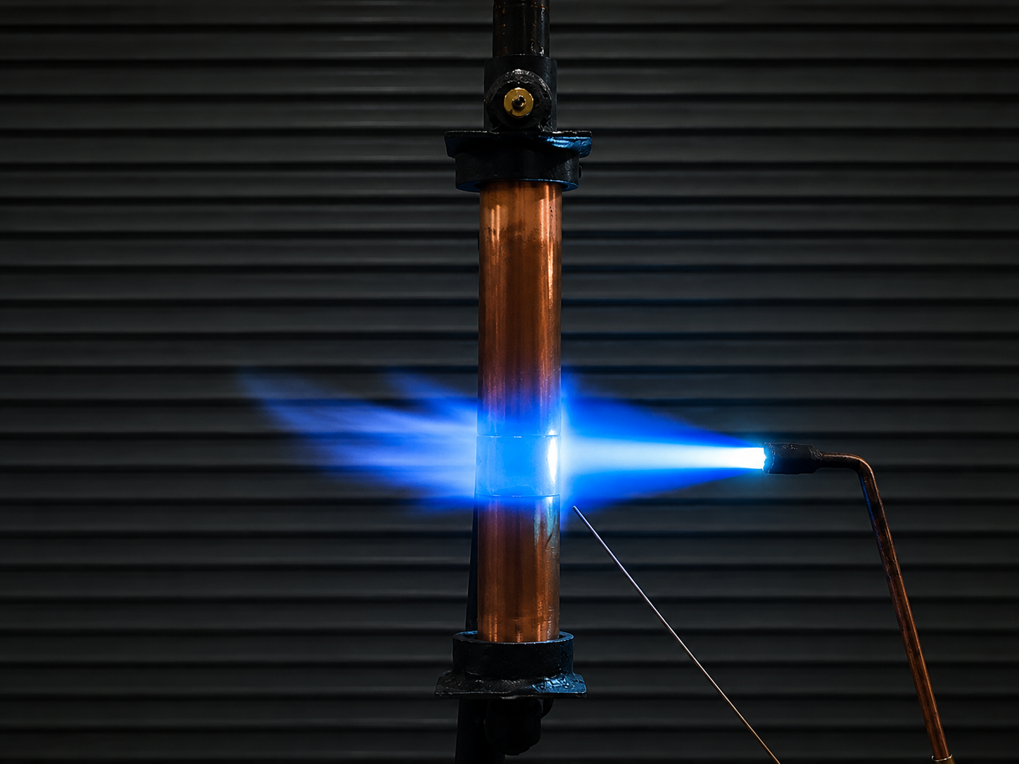 Vertical copper brazing demonstration with flame